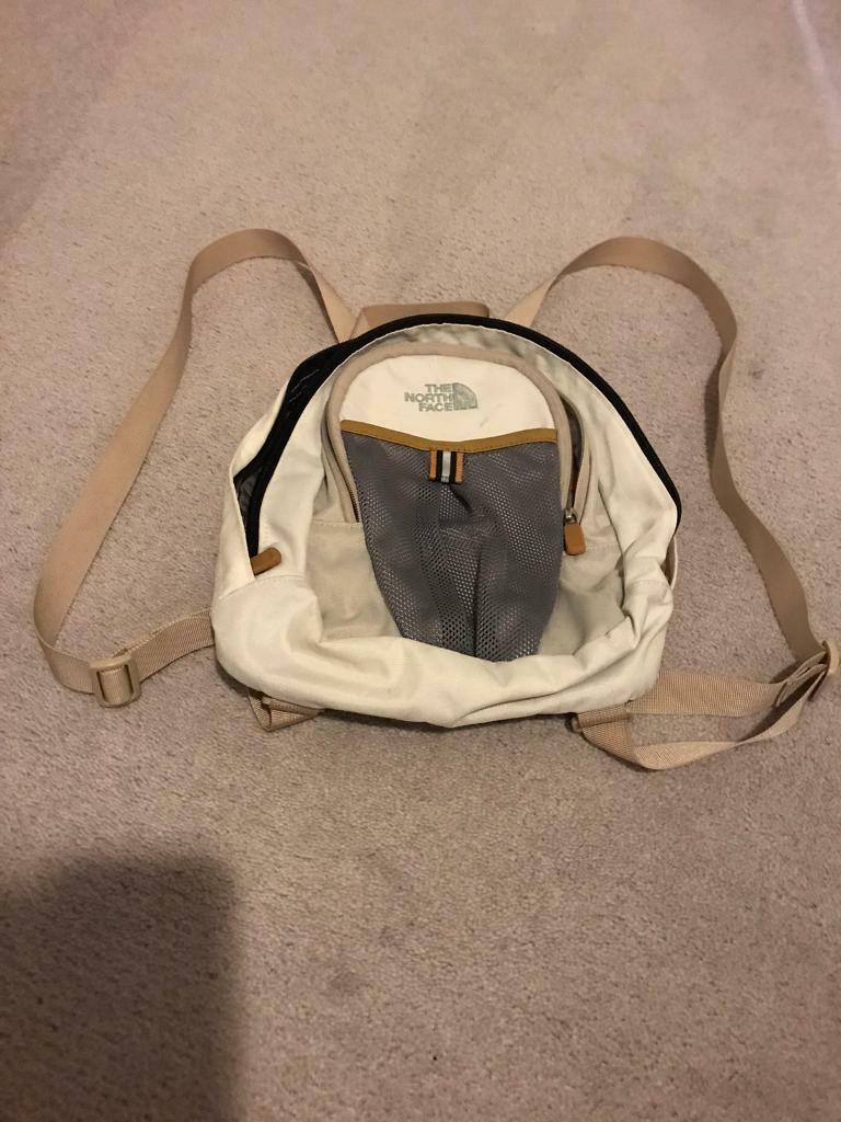 cream colored north face backpack